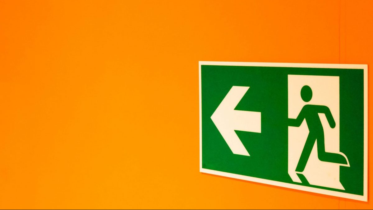 Exit sign on orange walls