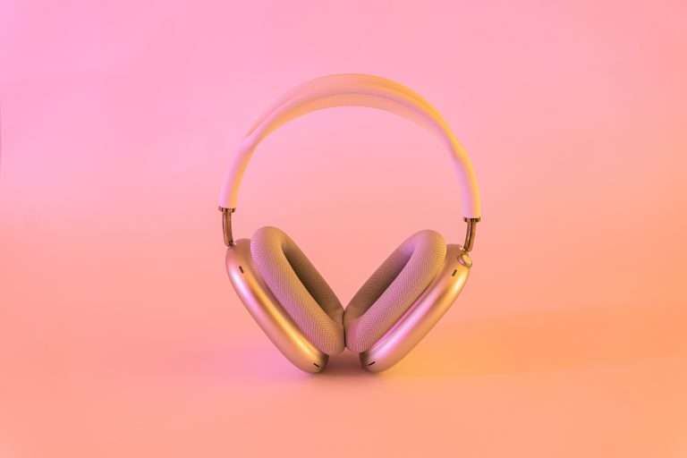 pink background with pick headphones