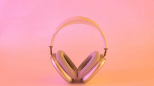 pink background with pick headphones