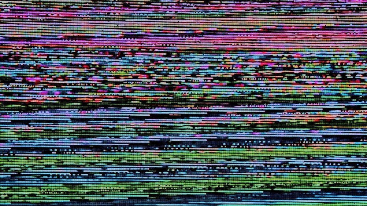 disorted tv or digital signal with multicolor pixel lines.